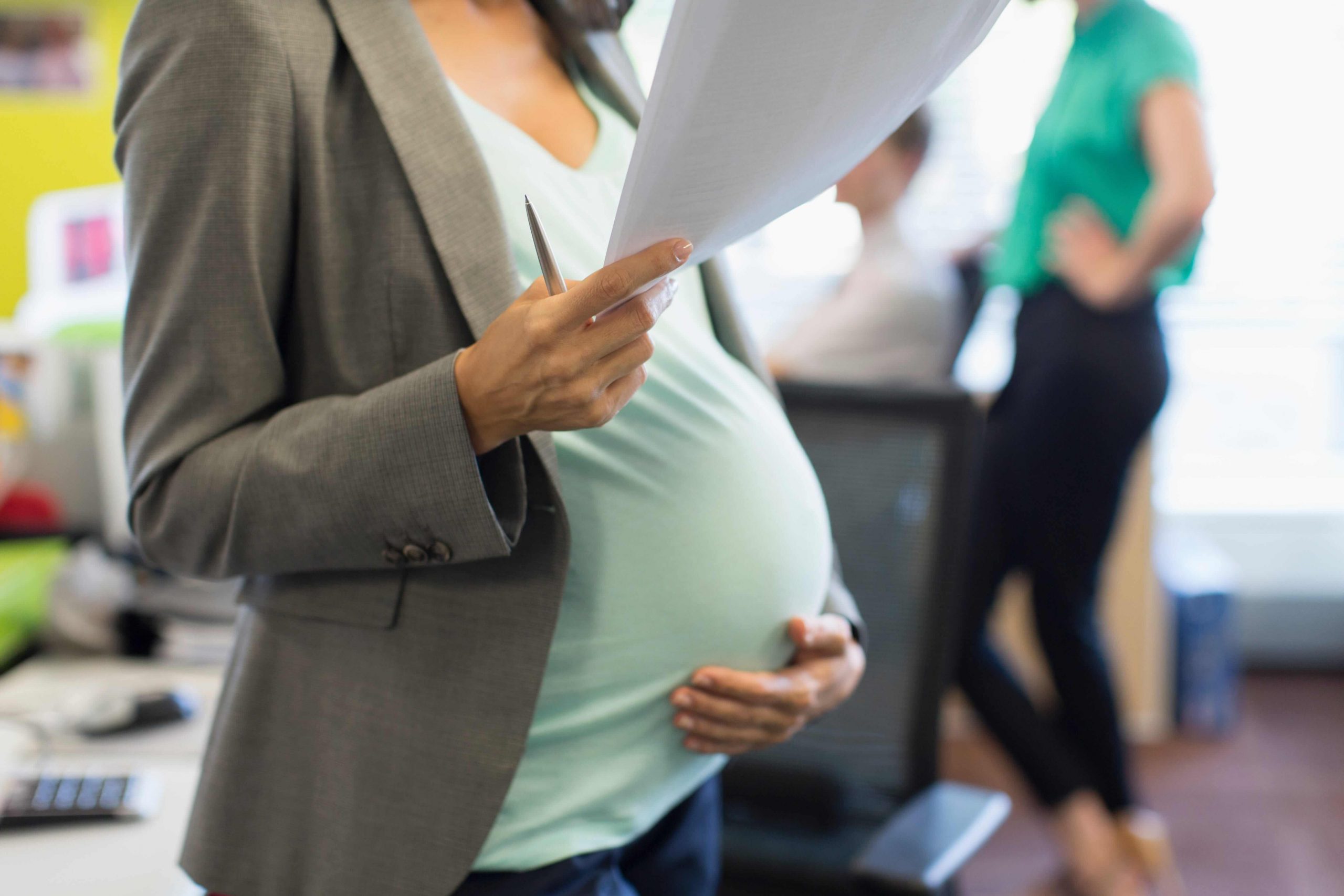 Pregnant woman working in the office