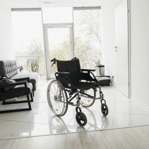 Modern wheelchair in empty hospital hall. Medical equipment. High quality photo